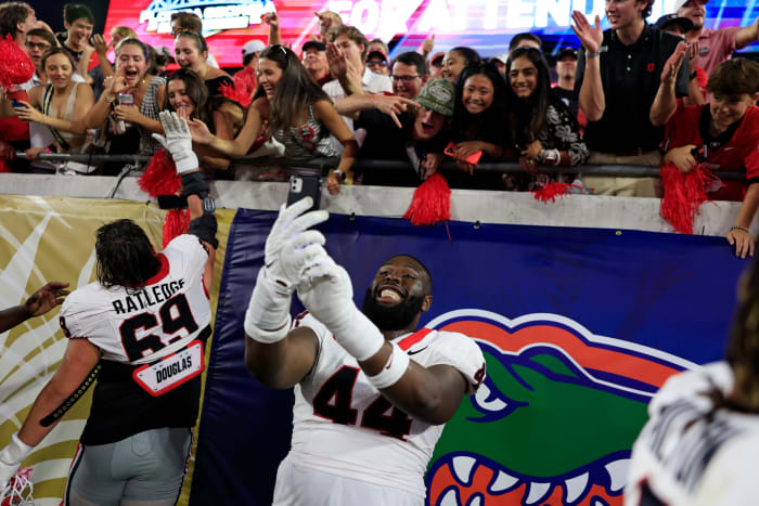 Georgia Bulldogs defensive lineman Jordan Hall (44) takes a selfie for a fan after the game of an NCAA Football game Saturday, Oct. 28, 2023 at EverBank Stadium in Jacksonville, Fla. Georgia defeated Florida 43-20.